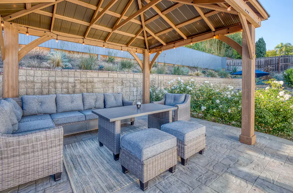 California Care's mental health residential backyard gazebo with a sitting area that seats many people and a table in the middle