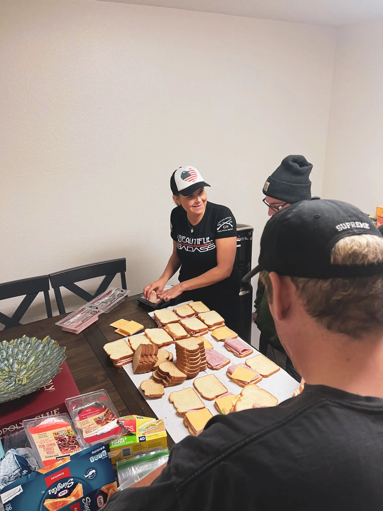 Mental health outpatient volunteer work. Volunteers are making sandwiches for the homeless