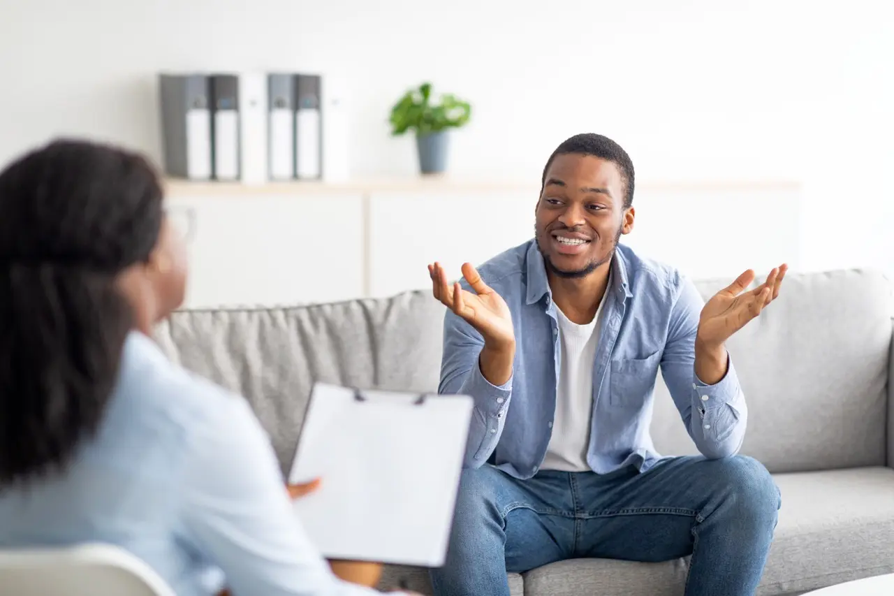 Client discussing depression treatment with a primary therapist in Orange County, California