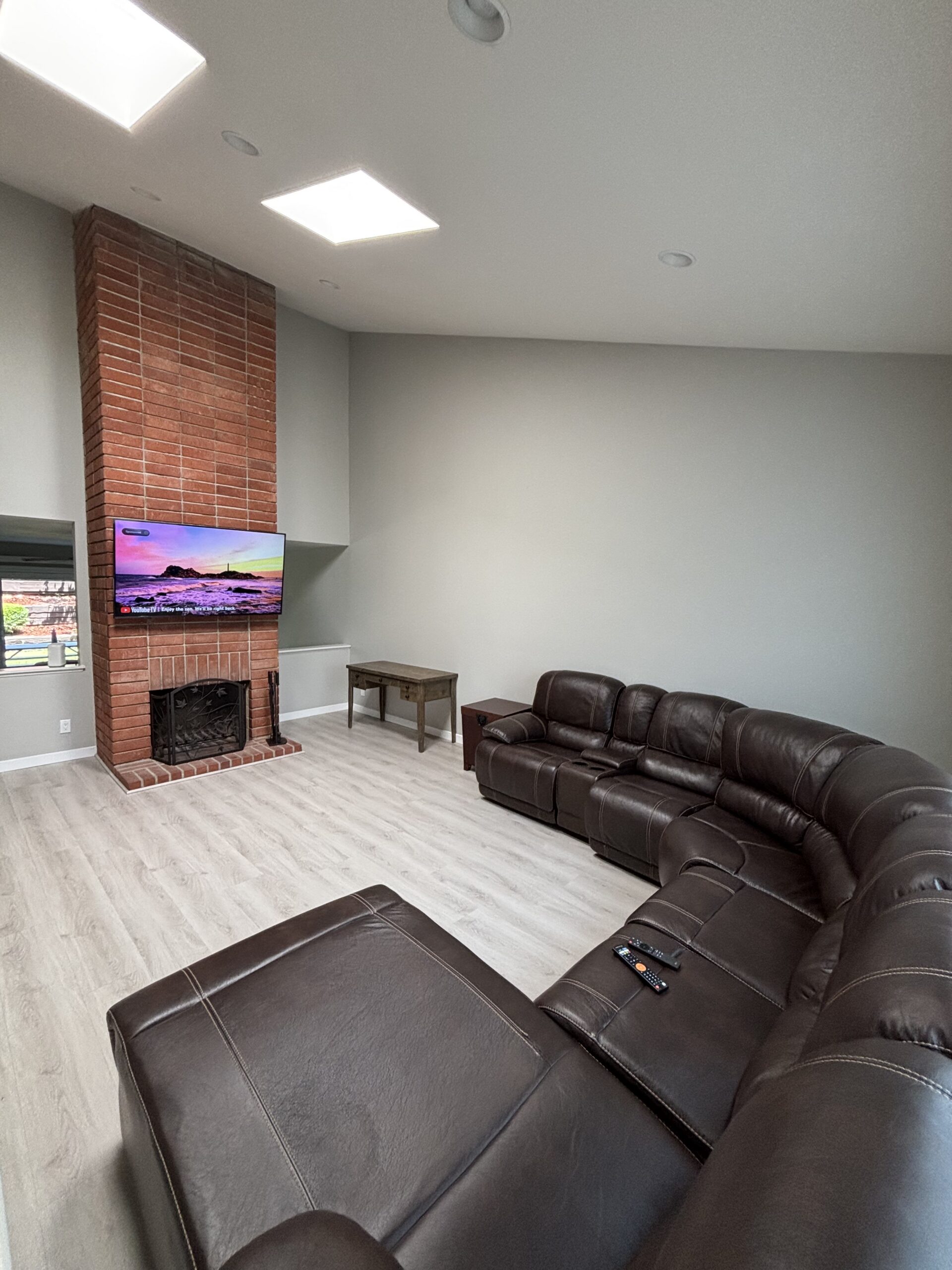 Living room with a fireplace at our men's transitional living home in Lake Forest